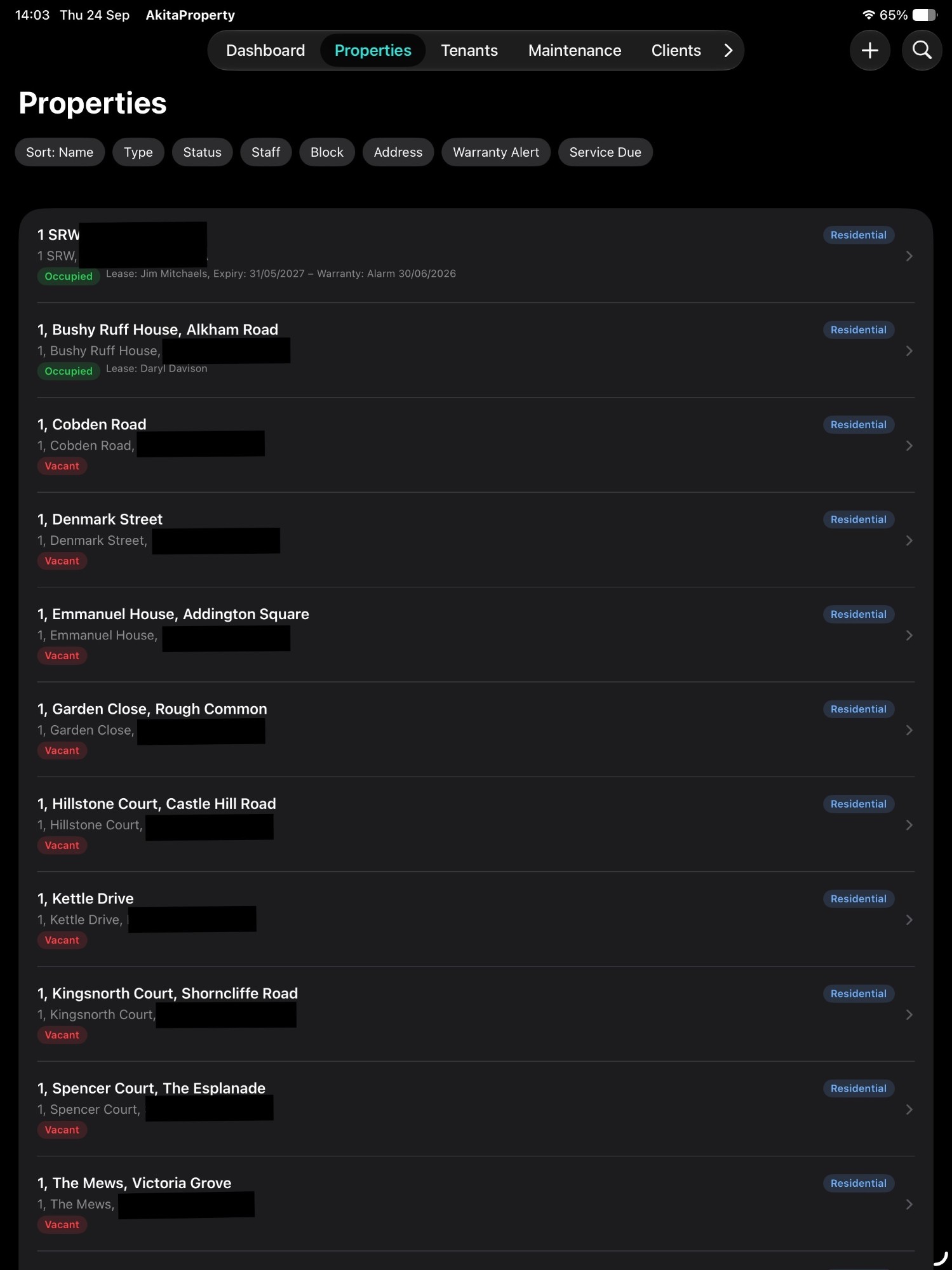 AkitaProperty properties list on iPad, with filters for type, status, staff, block, warranty alerts and service due, and each property showing its occupancy